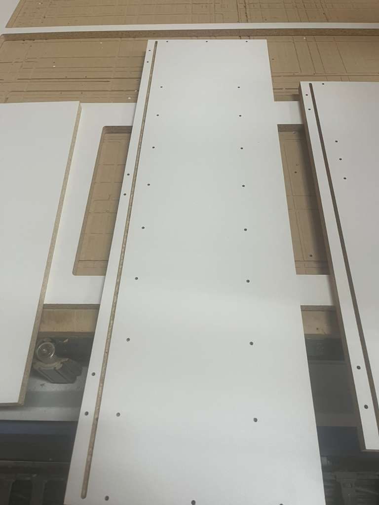 Cabinet side panels drilled for shelf pins